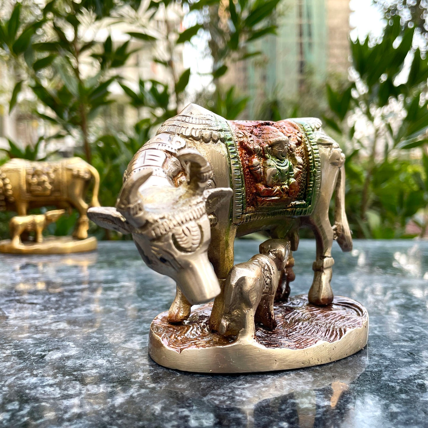 Brass cow with colourful design
