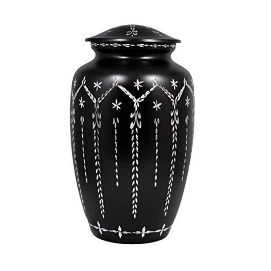 Black urn with white decorative patterns