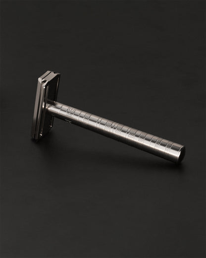Disassembled Henson Ti22 Razor showing top cap, base plate, and handle with Nitronic 60 stainless steel anti-seize threads.