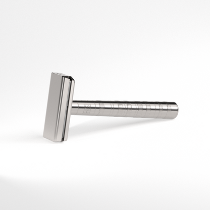 Macro view of Henson Ti22 razor head showing precision 0.0005 inch blade exposure for irritation-free shaving.